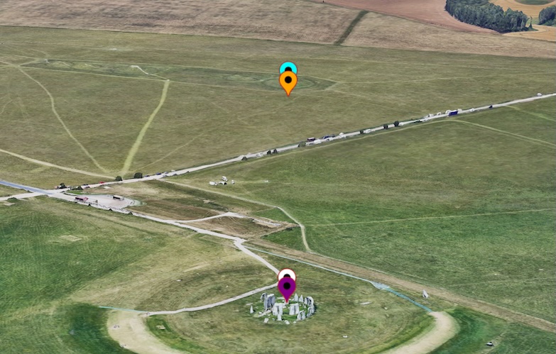 A 3D map scene showing multiple pins (white, purple, orange, blue) positioned using different altitude modes, all centered around Stonehenge.